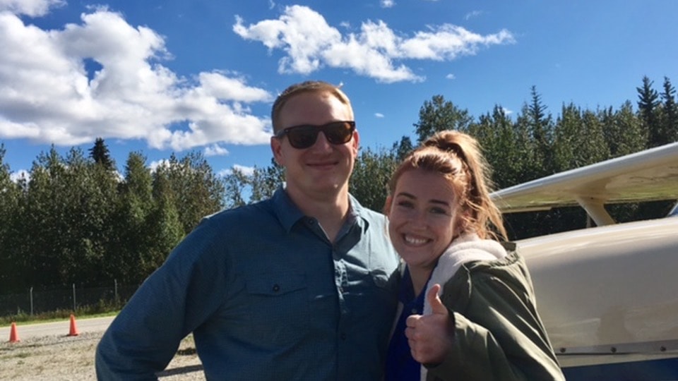 Instructor and student smiling together next to ProFlite aircraft