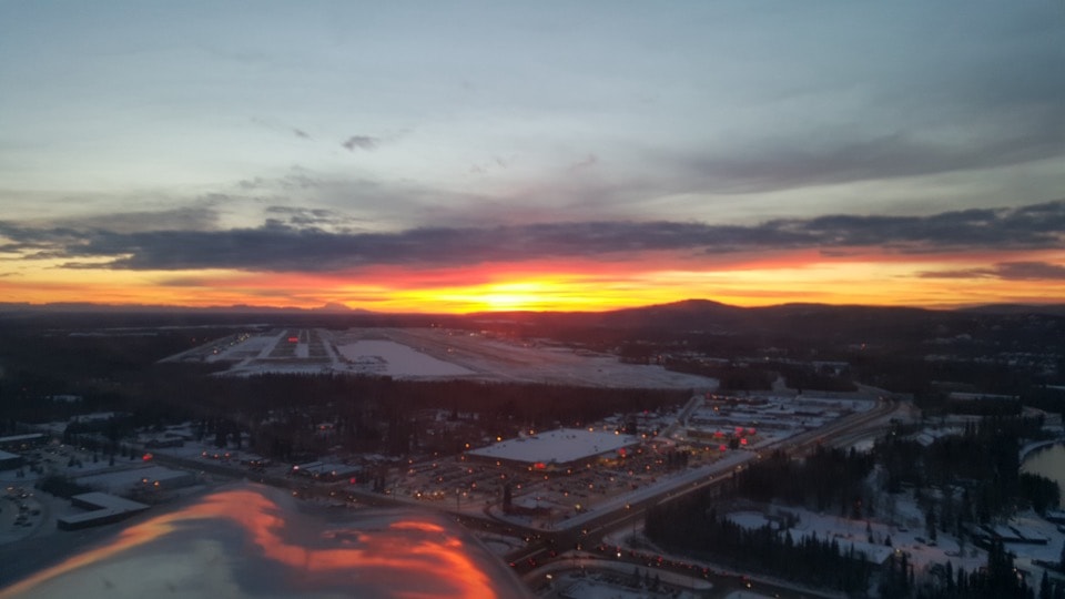 Aerial sunset over Fairbanks International Airport in winter